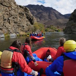 Students posing on rafts during Spring Break Rafting on the Deschutes River, OR