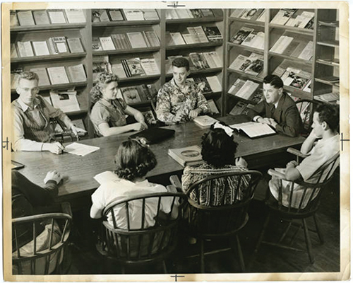 Students gathering in the library study area, ~1940's