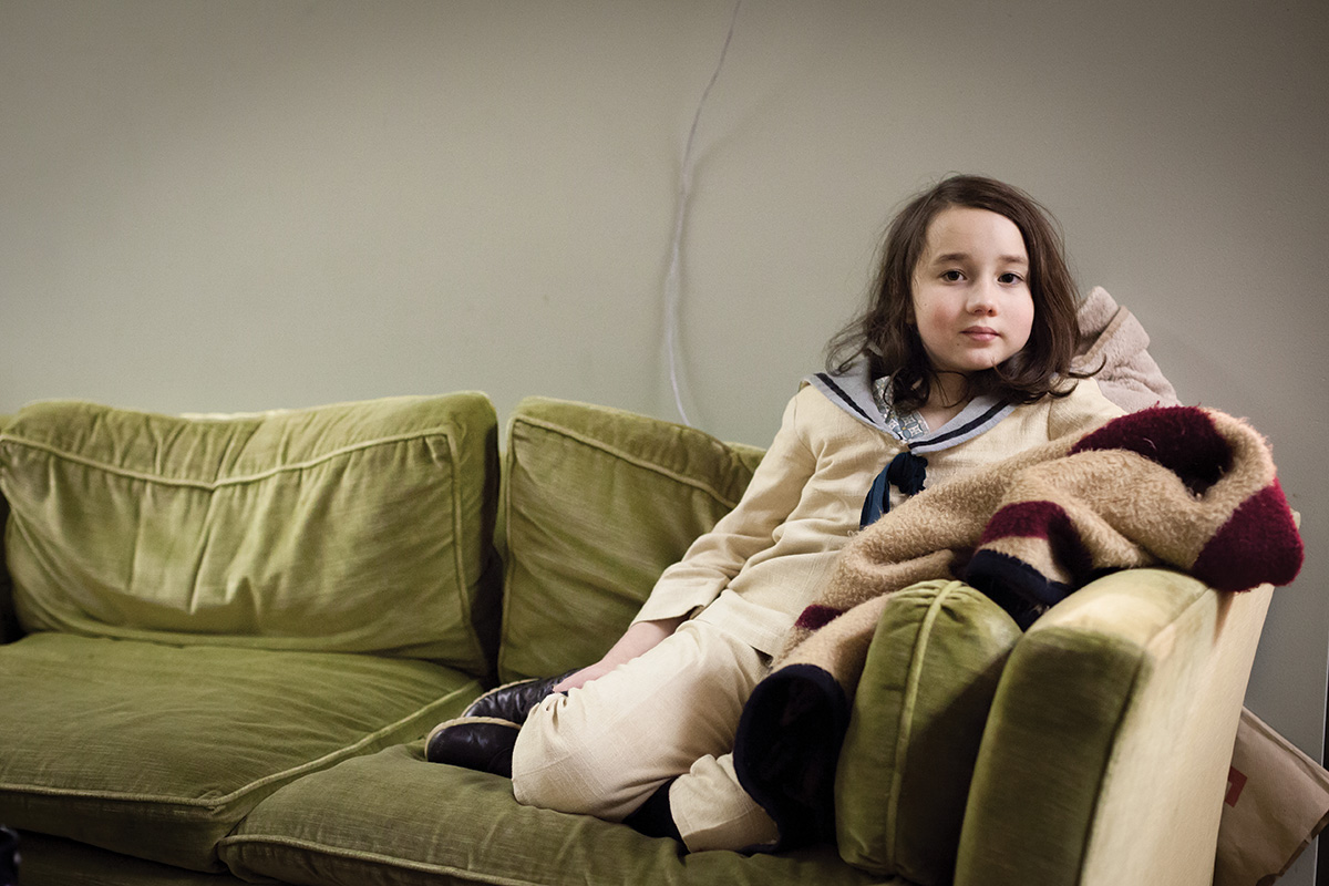 Young female seated on the couch