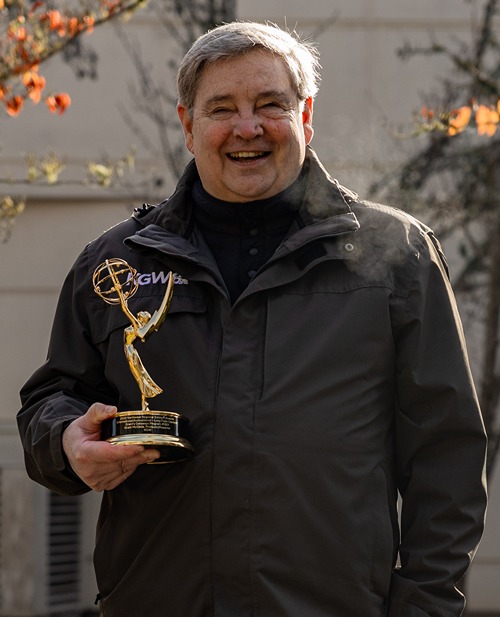 Grant McOmie Holding His Emmy Award