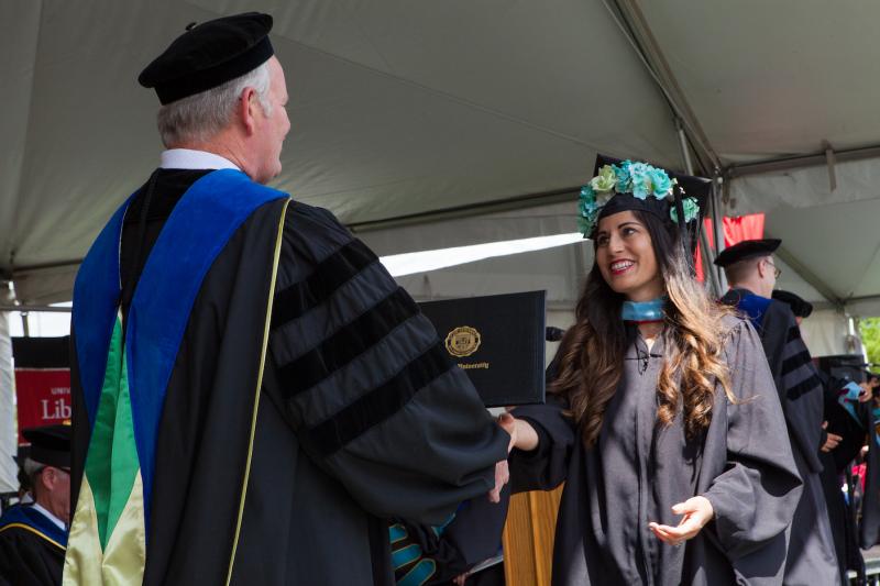 Claudia McClellan receives her degree at Commencement