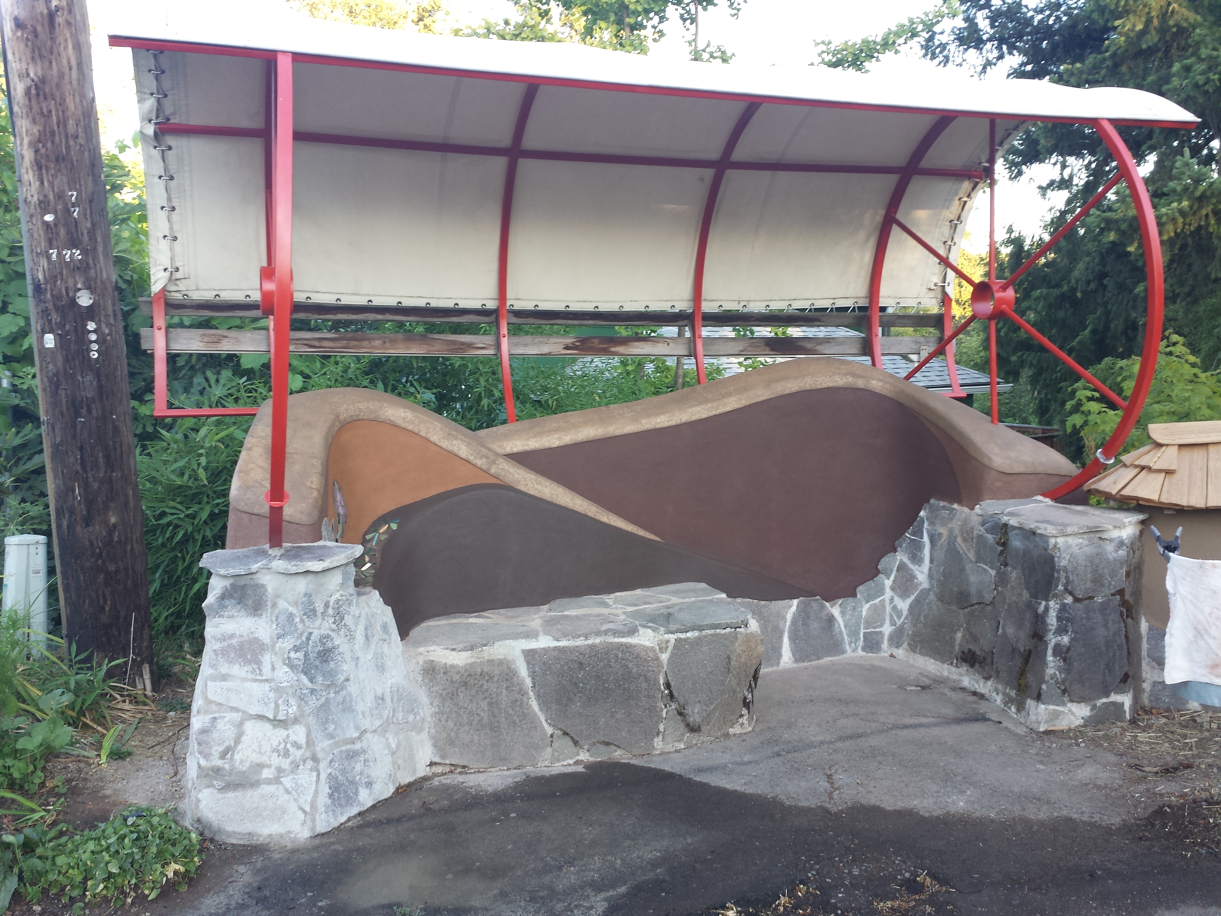 Bus Bench, Oregon City |  "A partnership between the home owners, Oregon City, Tri-Met, and the Village Building Convergence allowed me to lead the initial construction of this bus stop. After it got hit by a car I created a new design and reworked the bench."