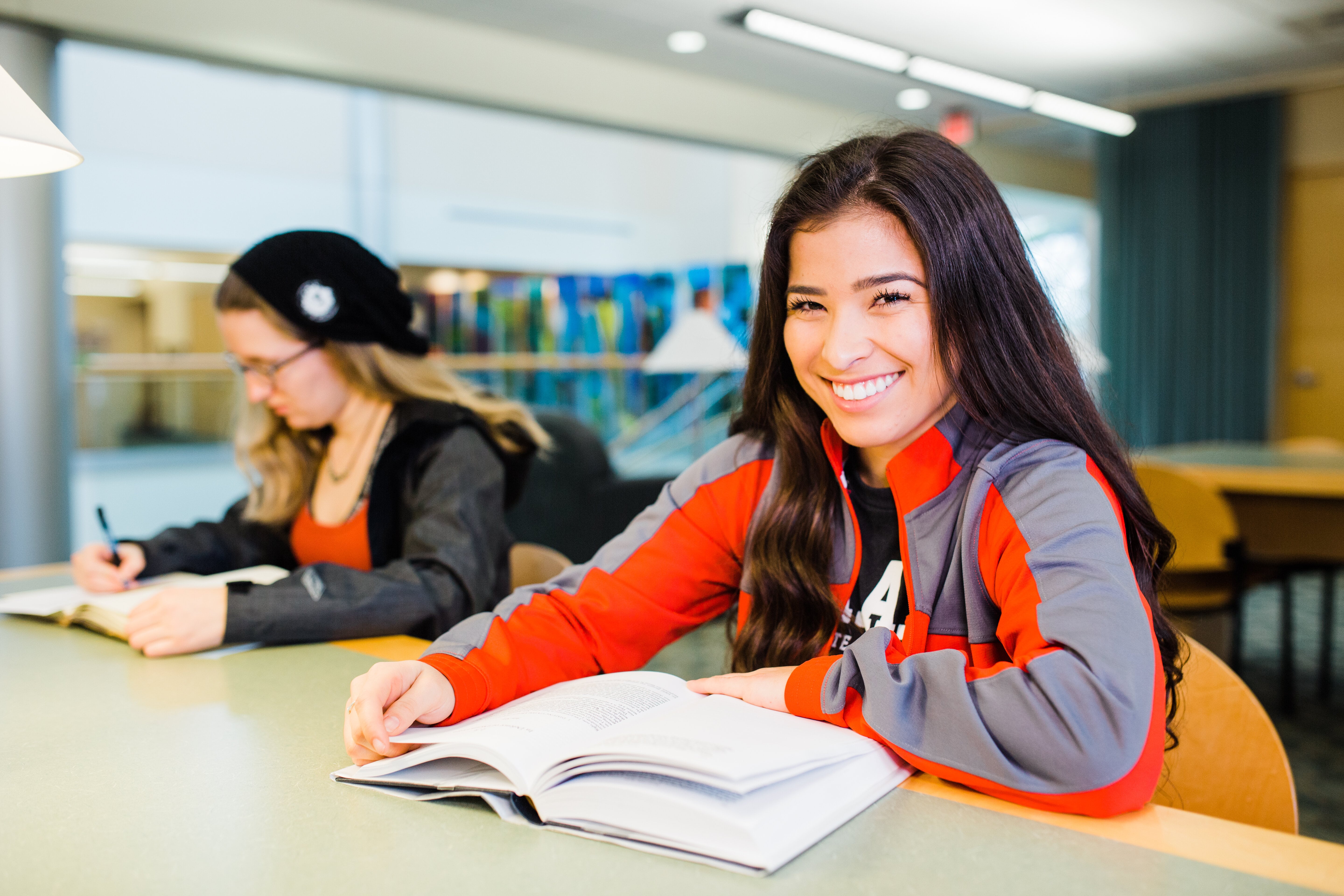 Two Pacific students study at the library on the Forest Grove campus.