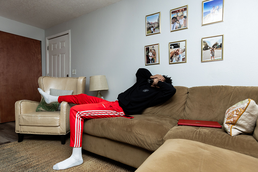 Devin Fortune '25 rests on a couch in his home after a long day