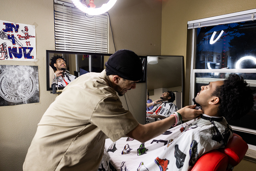 Devin gets a haircut from fellow student Jay Fordham '25