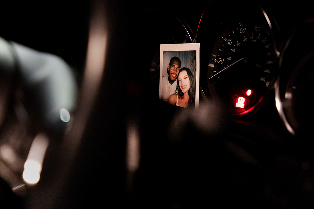 Devin keeps a photo of himself and his wife Kristina on his dashboard