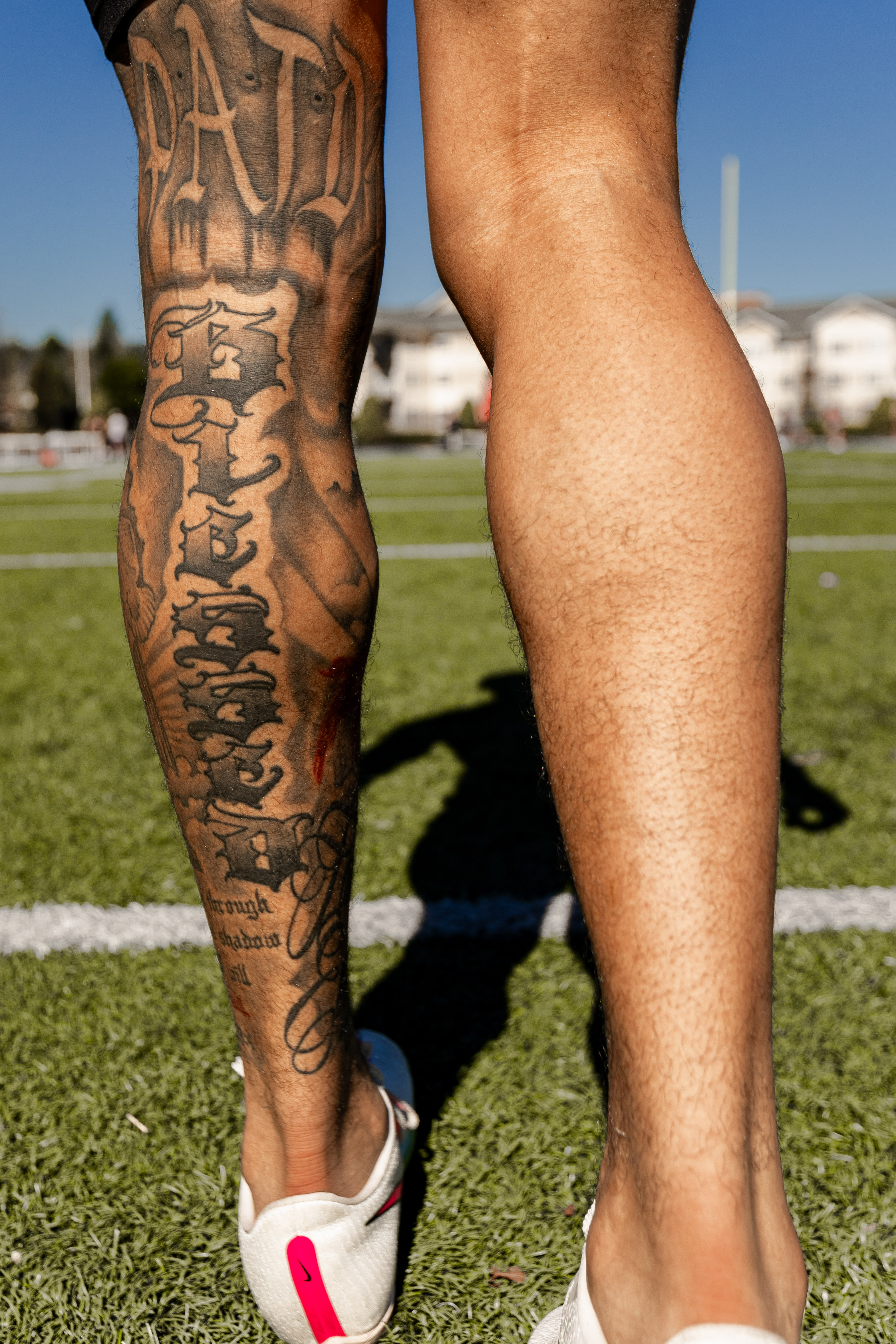 A tattoo on the back of the leg of Jay Fordham '25 proclaims his motto: PATD, or pay attention to detail