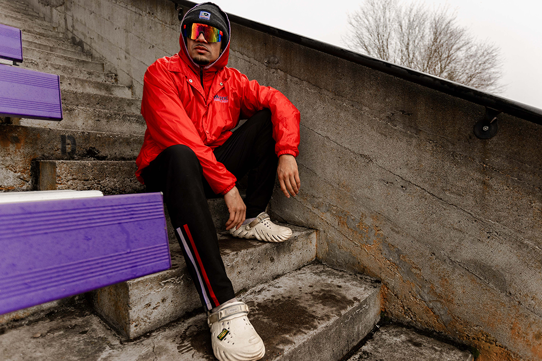 Jay Fordham '25 sits on the bleacher steps