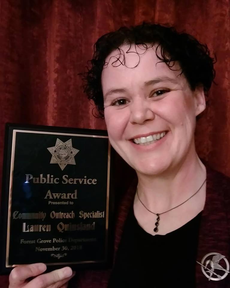 Laura Quinsland with the Public Service Award