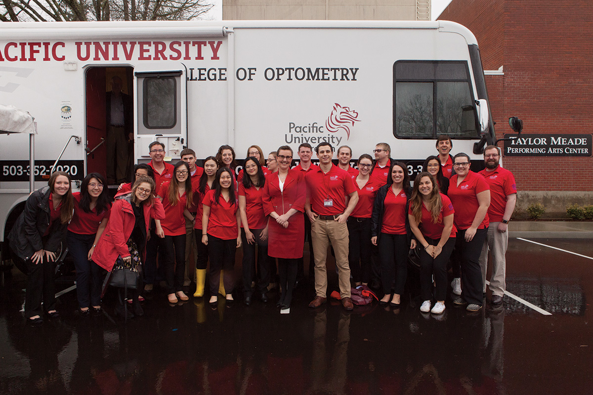 Pacific University Eye Van with Students Posing in Front 