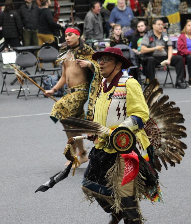 People in cultural wear performing