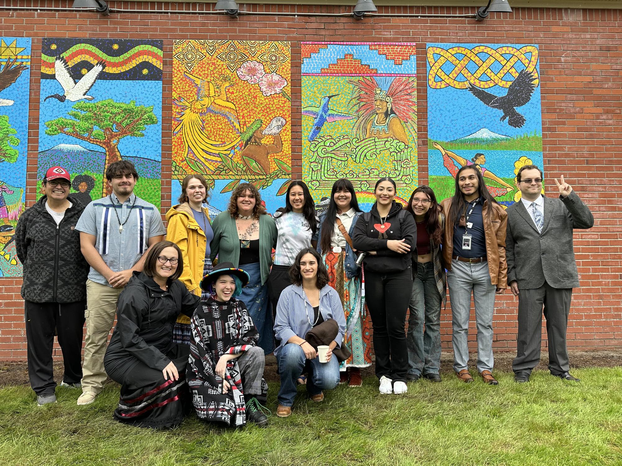 ISA members standing in front of mural