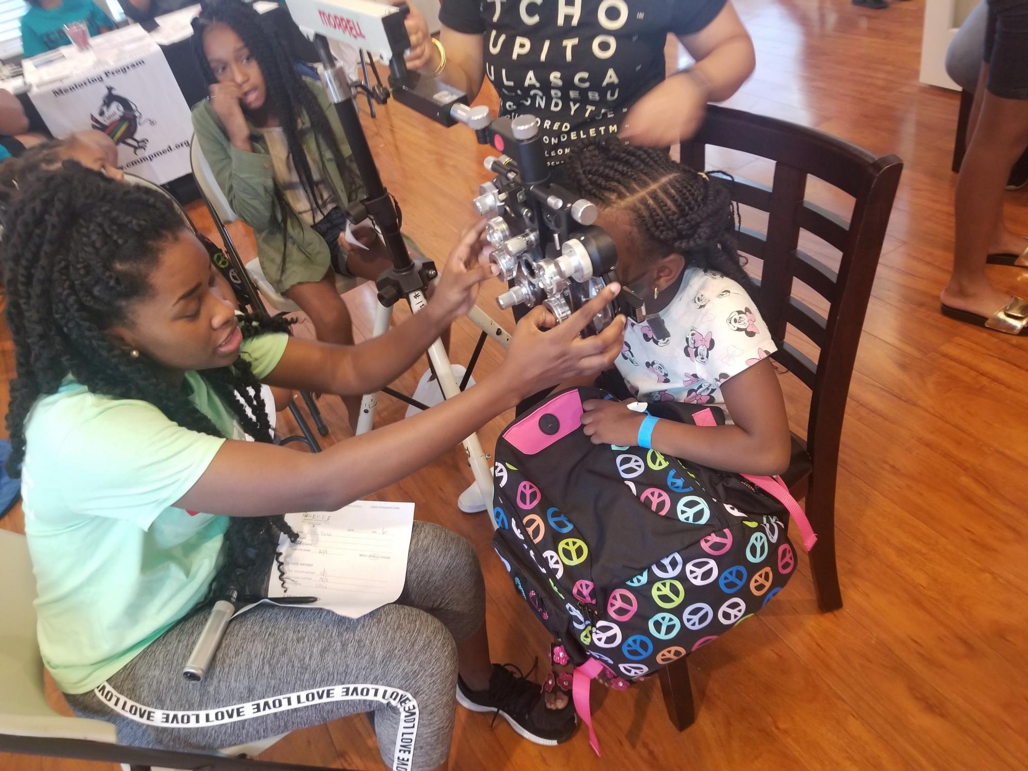 Breanne McGhee introduces children to optometry