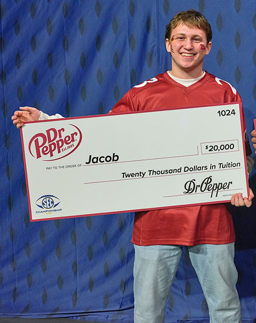 Jacob Boyce '27 With Large Dr Pepper Check