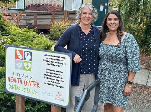 Rebecca Chown '98, OD '03 and Anna Elias Outside Of The Hood River Valley High School Health Center