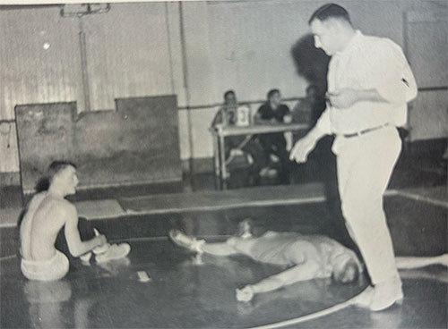 George Tall Chief Coaching Pacific University Wrestlers