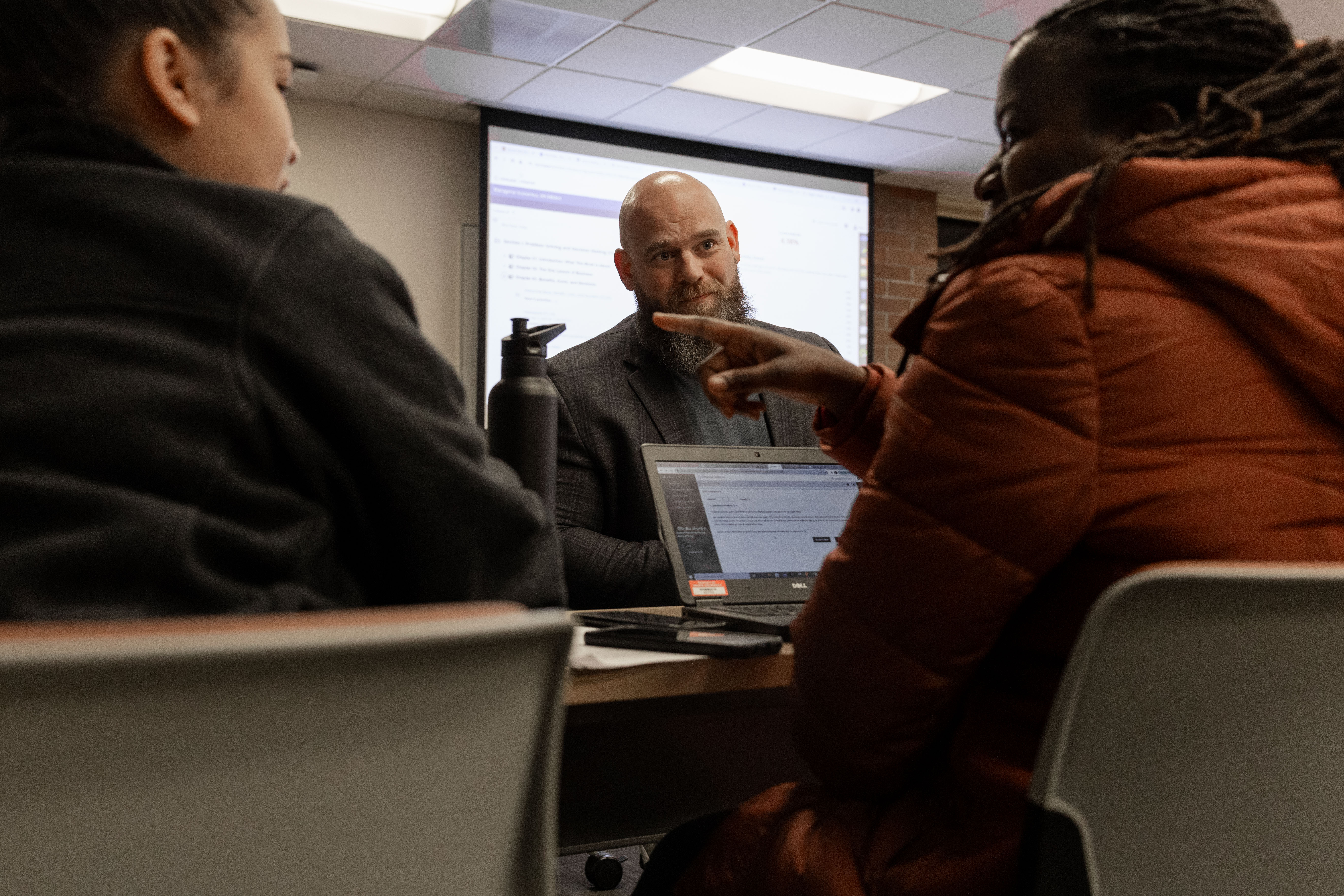 Chris Linn MBA '25 takes part in small group discussion during class at Pacific's Hillsboro campus.