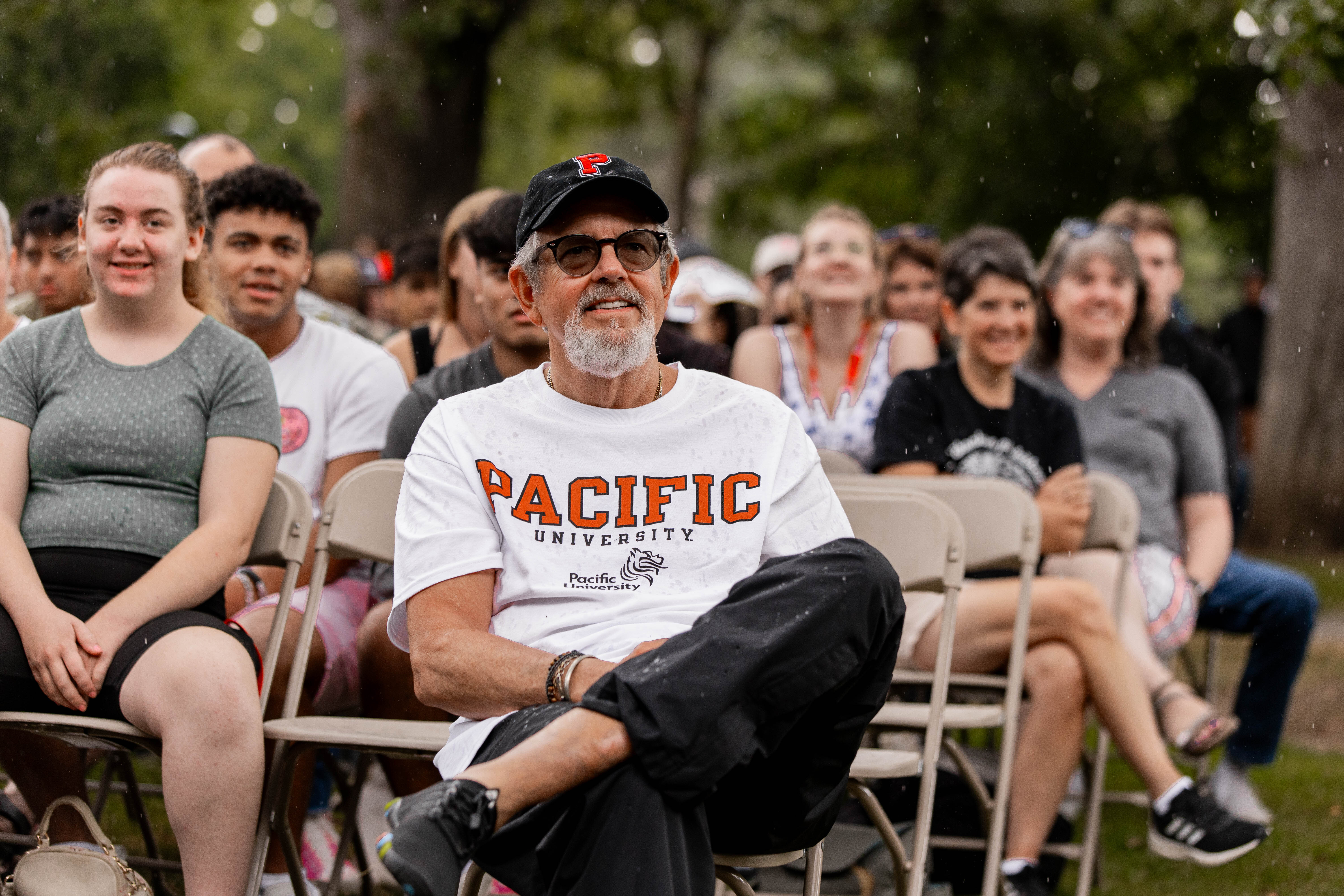 A guardian of a Pacific student looks on during an orientation event.