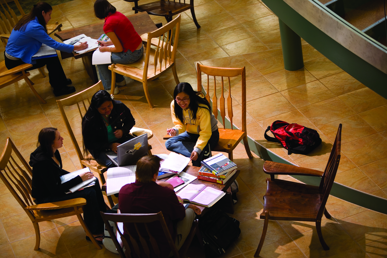 A group of students study together in the Pacific library.
