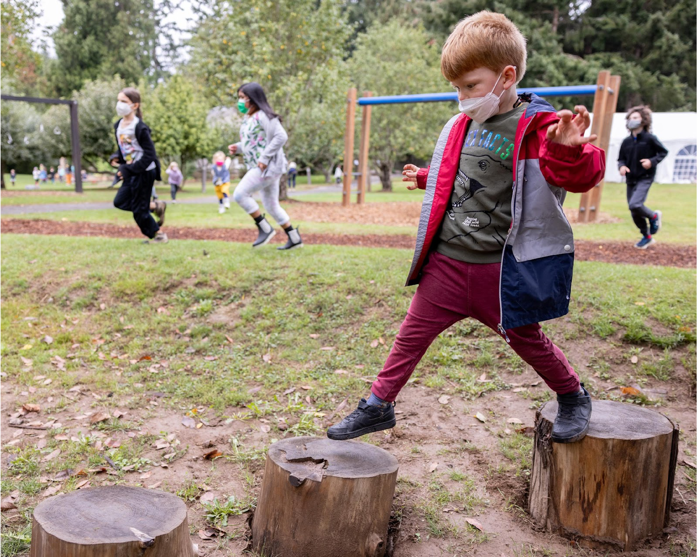 Children play outdoors at Arbor School