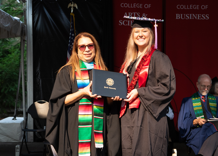 Simonne Lighthouse receives award at August commencement