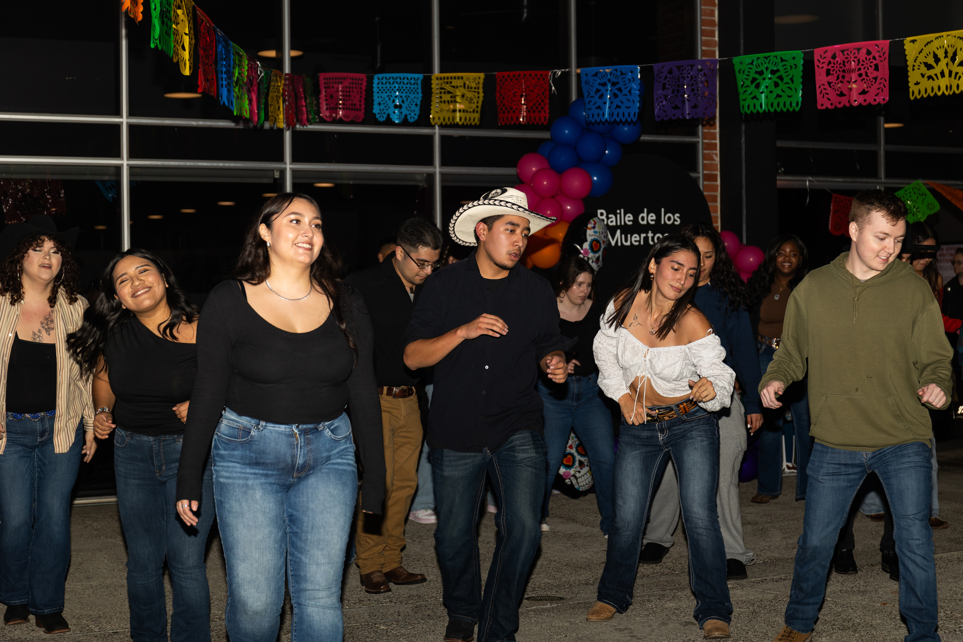 Pacific students line dance at Día de los Muertos dance hosted by a student club