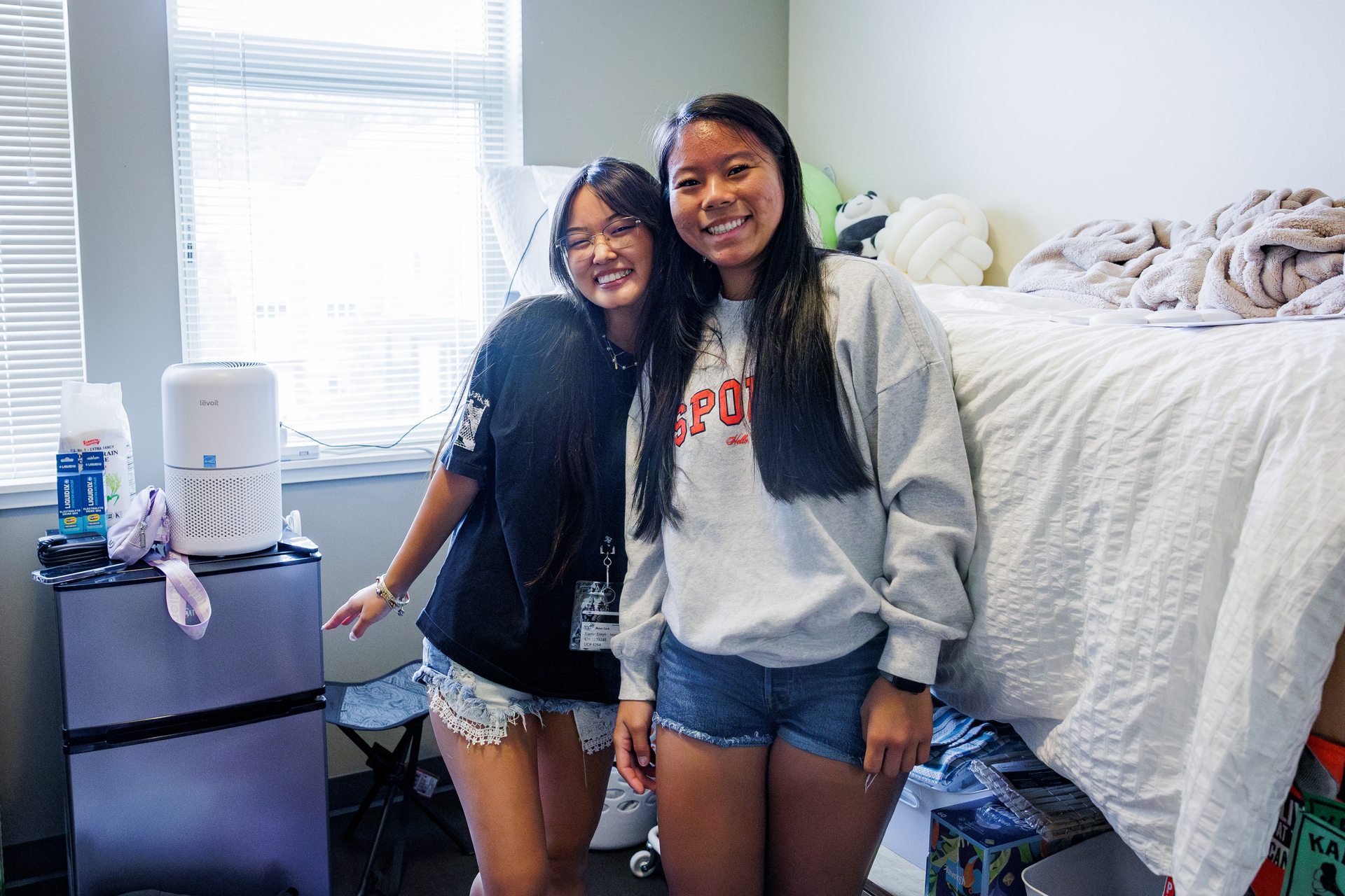 Two Pacific students pose in their residence hall room