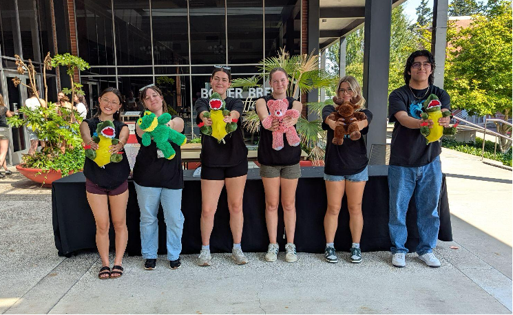 Pacific University students hold stuffed animals