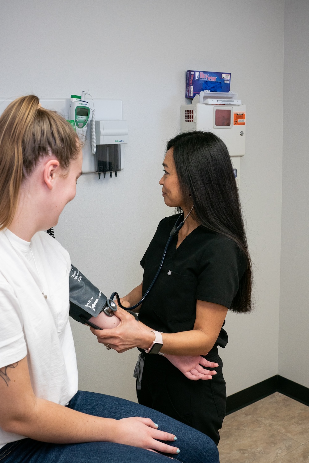 nurse taking blood pressure