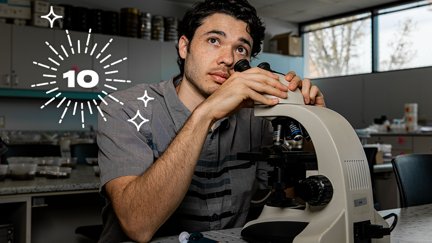 Duncan Anderson '24 Posing With Microscope