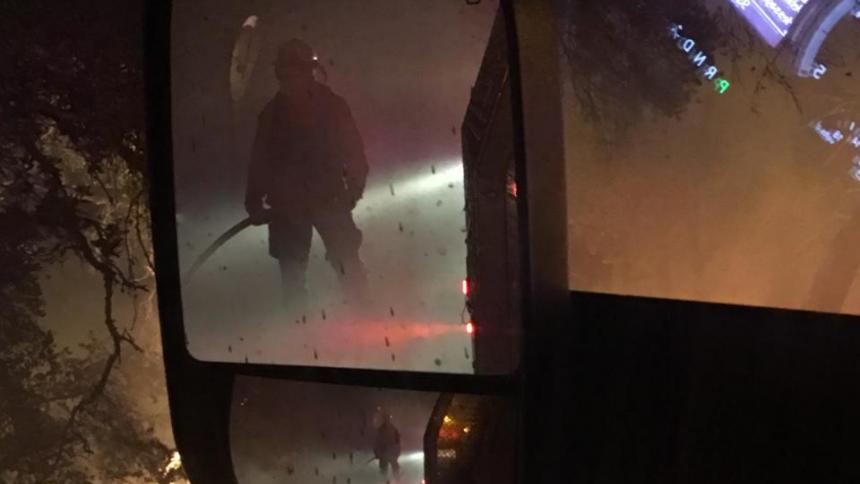Firefighter surrounded by flames. 