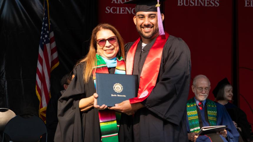 Javier Barron receives award at August commencement