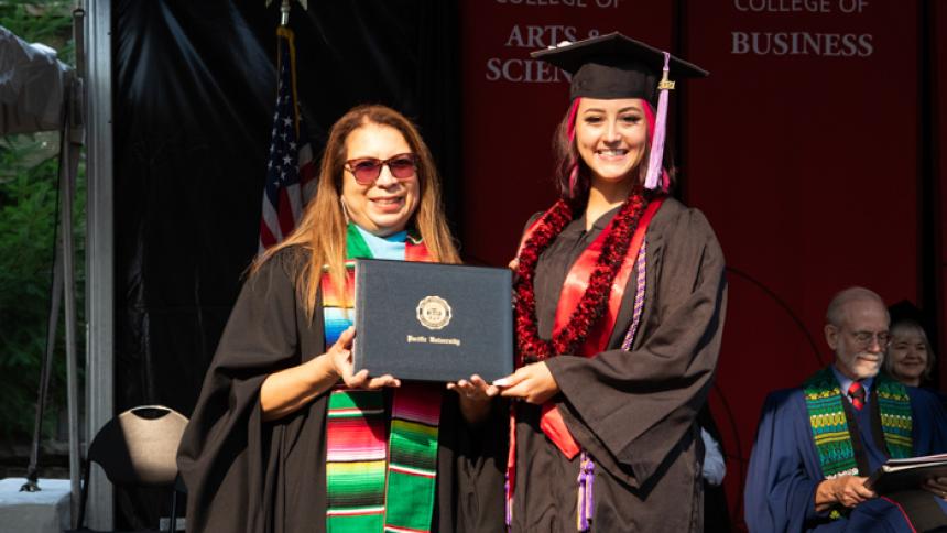 Destyne Johnson receives award at August Commencement