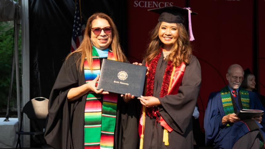 Misha Lagman receives award at August commencement