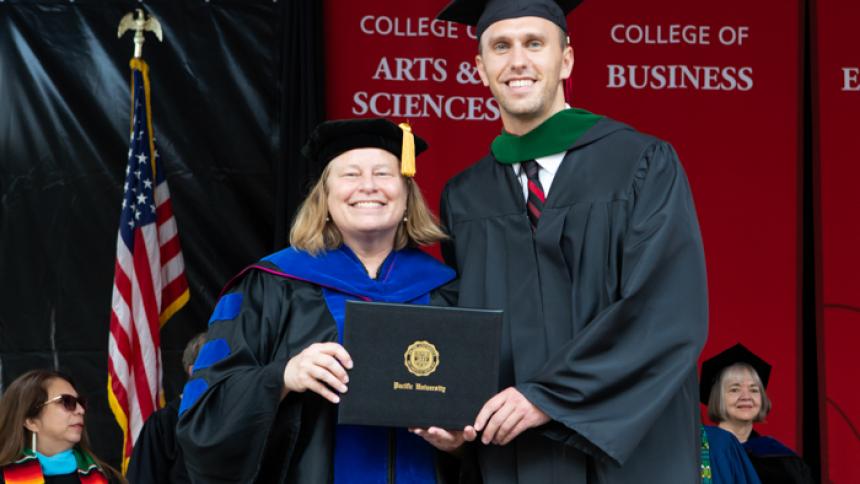 Andrew Campbell receives award at August commencement
