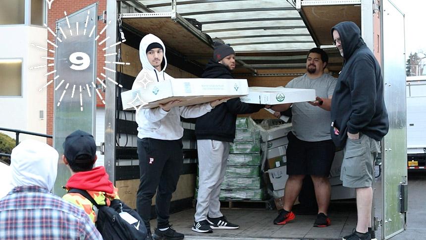 Students unload donations for the annual Lū‘au and Hō‘ike country store at Pacific