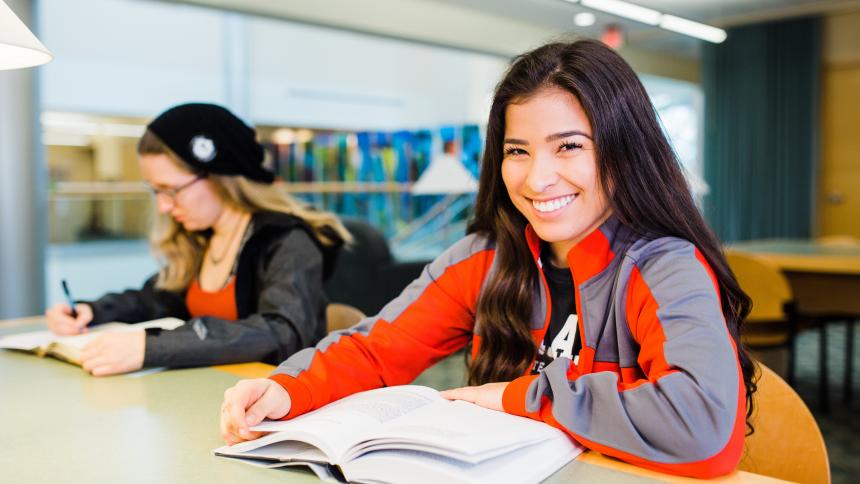 Two Pacific students study at the library on the Forest Grove campus.