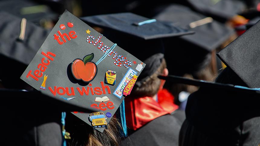 Graduation cap decorated to read Teach the Change You Wish to See