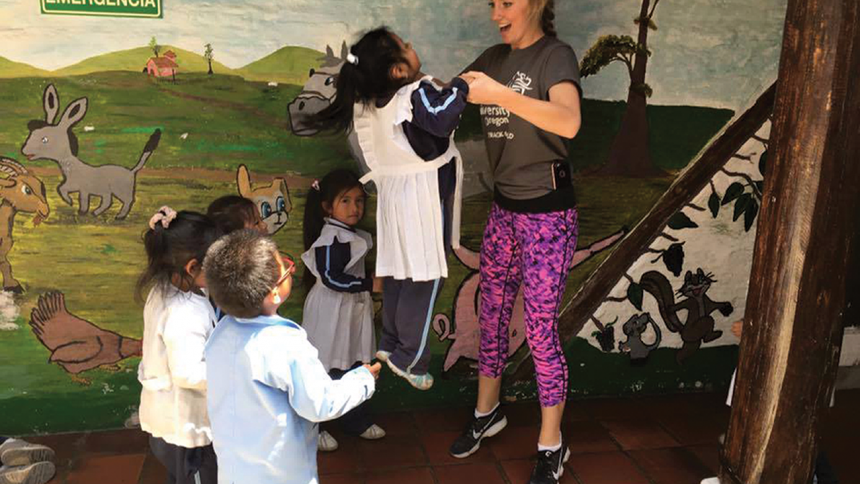 Shannon Hammond working with the children in Ecuador