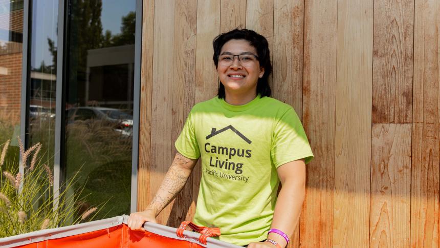 Student wearing a campus living t-shirt