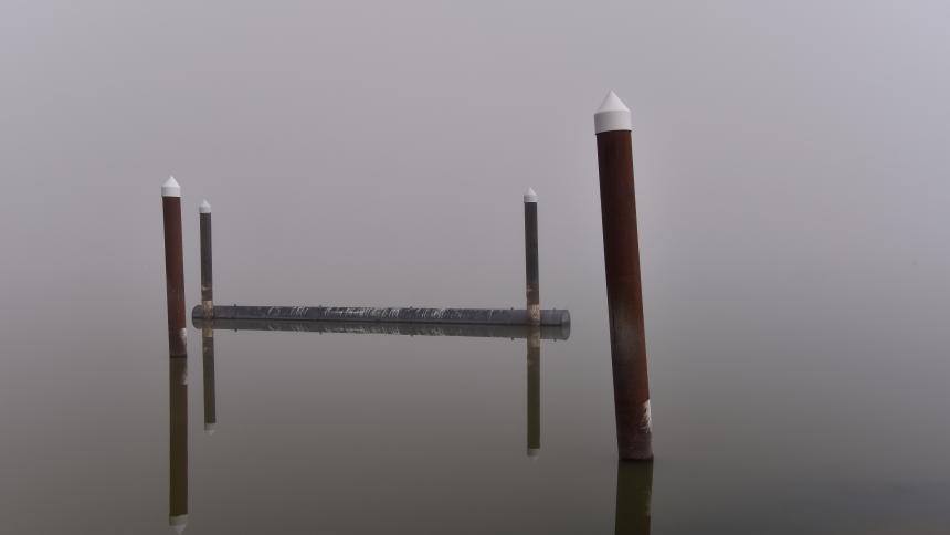 image of a pier in the fog 