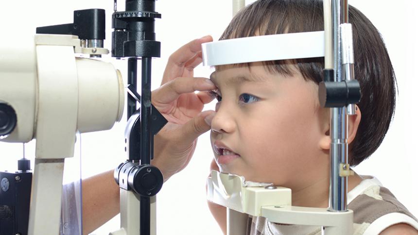 Child being examined by eye doctor