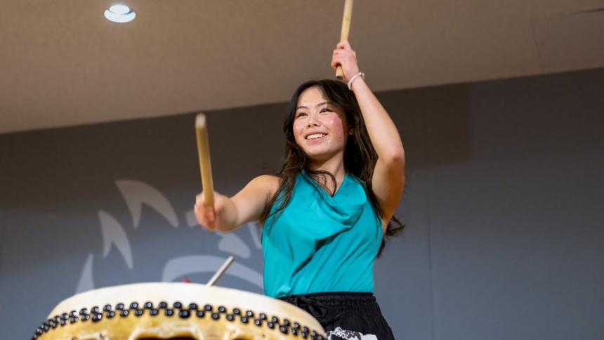 A student plays Taiko at the Pacific Lunar New Year ceremony.