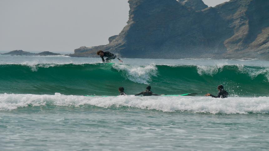 Surfers catch some waves along the Oregon coast. 