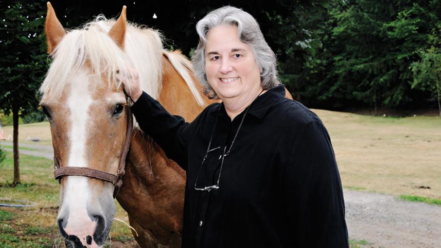 President Hallick pictured with her horse. 