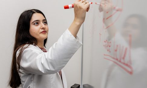 Pacific School of Pharmacy Student Hoda Veshagh Writing On A White Board