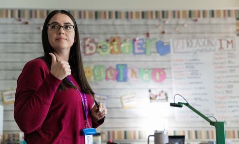 Melissa Aranda Stands In Front Of Her Classroom