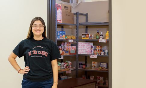 Ruth Gomez '19 in front of the Boxer Food Share