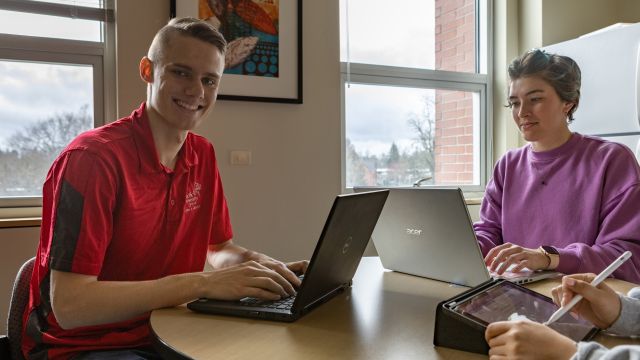 Biology professor and student working on an experiment