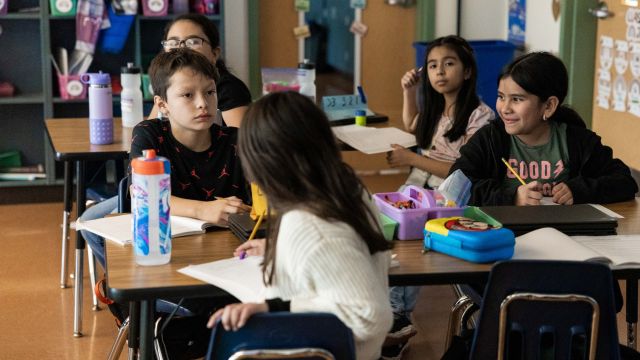 elementary school students at a table